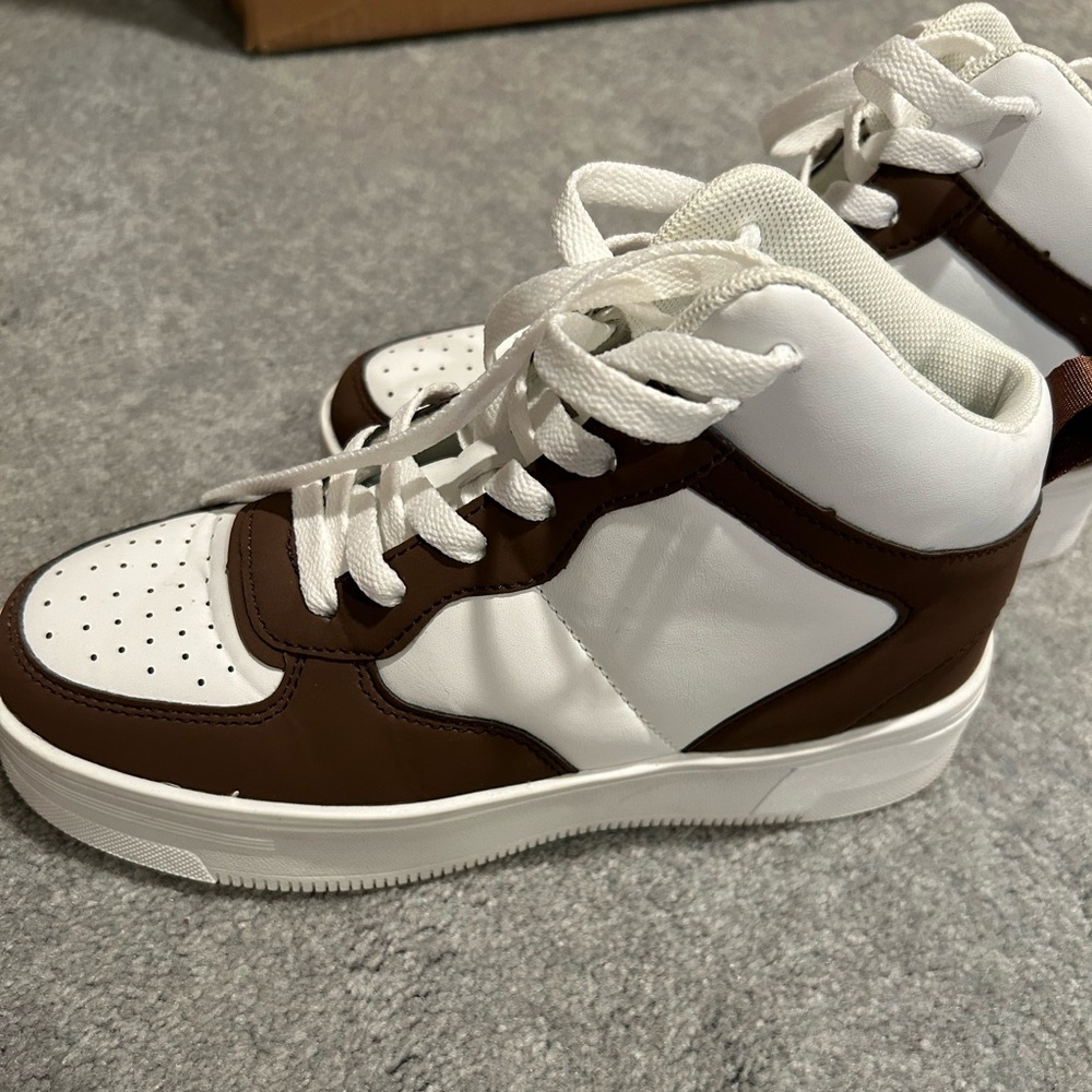 Brown and white high top sneakers